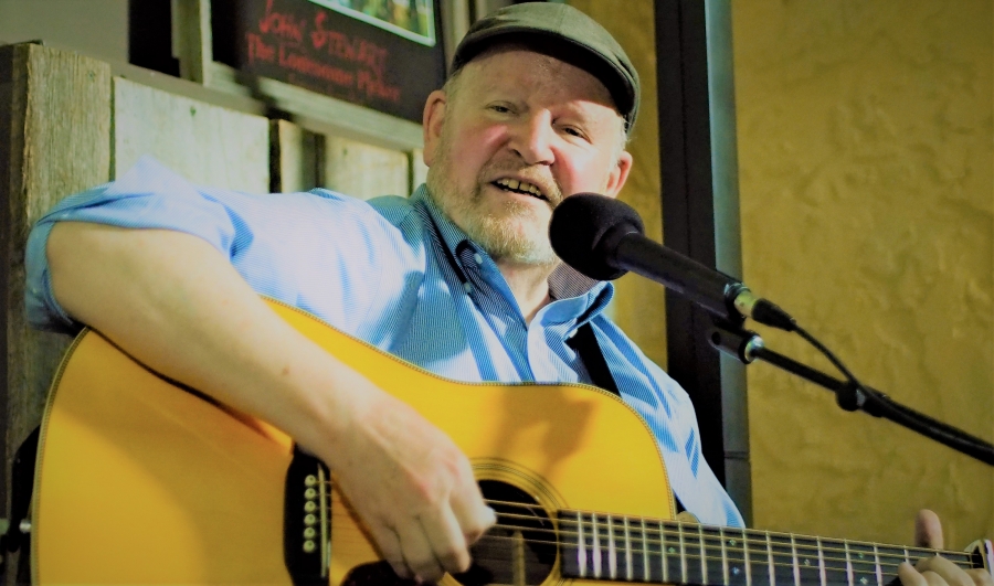 Tom O'Donnell playing a guitar